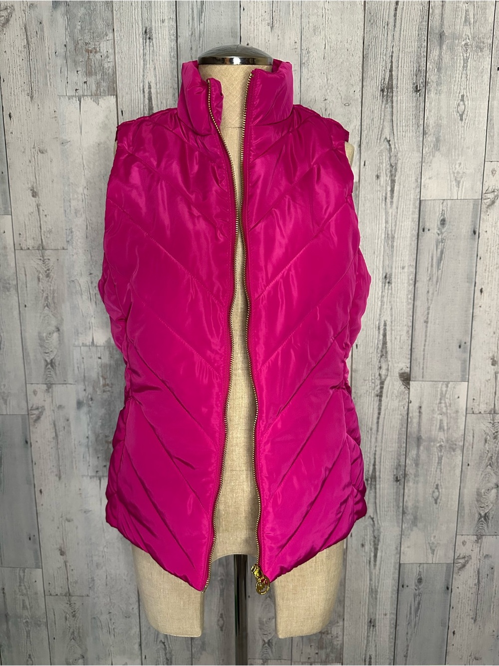 MK sleeveless puff vest in fuschia pink